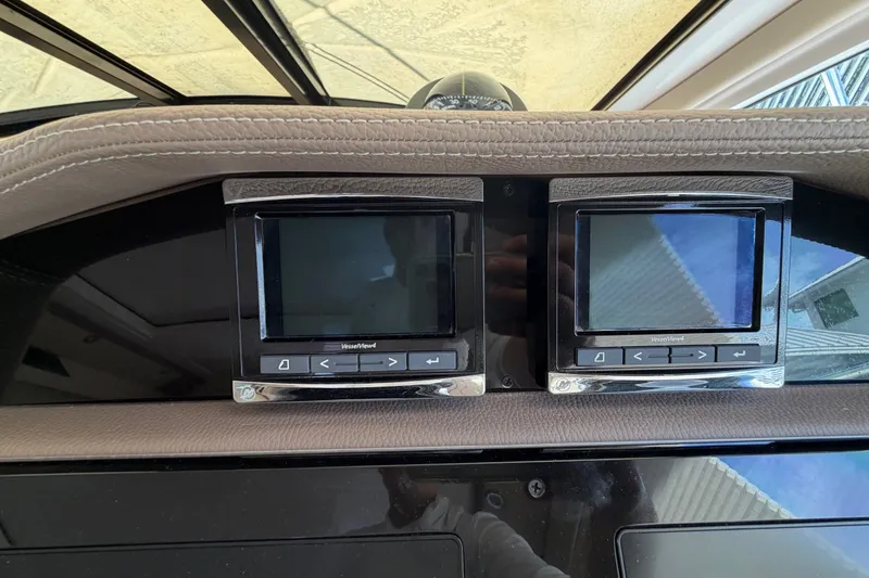 Slide: The Image of Dashboard of a 2018 Regal 53 Sport Coupe with dual VesselView displays. - 80