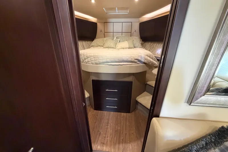 Slide: The Image of Luxurious bedroom interior of 2018 Regal 53 Sport Coupe yacht with elegant bedding. - 116