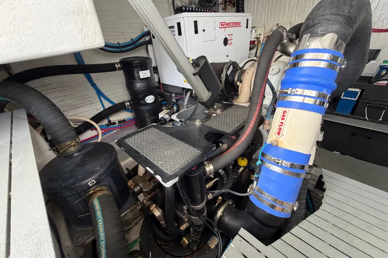 Slide: The Image of Engine room of a 2018 Regal 53 Sport Coupe with visible exhaust system components. - 64