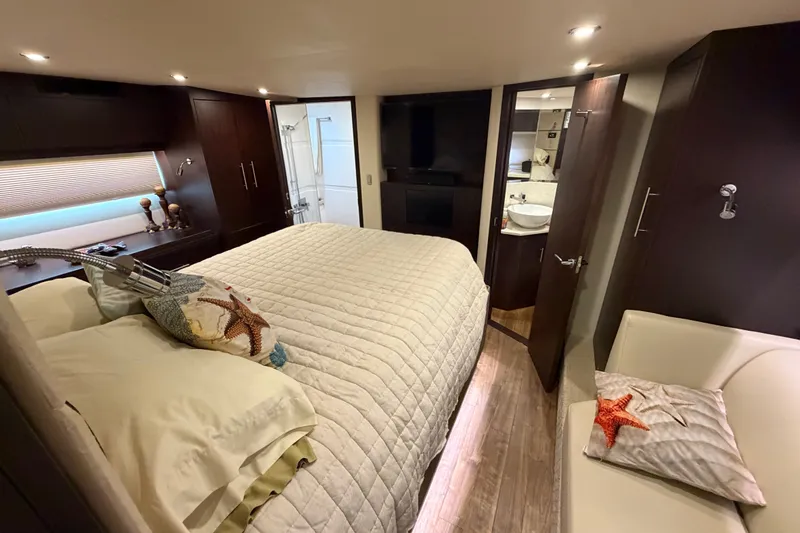 Slide: The Image of Luxurious bedroom interior of 2018 Regal 53 Sport Coupe yacht with modern amenities. - 109