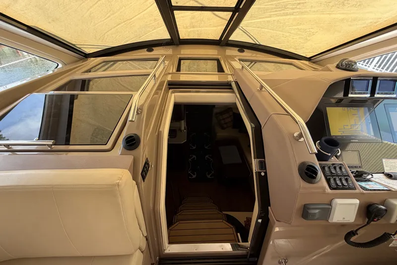 Slide: The Image of Interior view of 2018 Regal 53 Sport Coupe yacht cockpit with modern controls. - 86