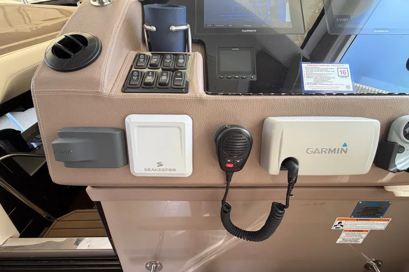 Slide: The Image of Control panel of a 2018 Regal 53 Sport Coupe with Garmin and Seakeeper systems. - 75