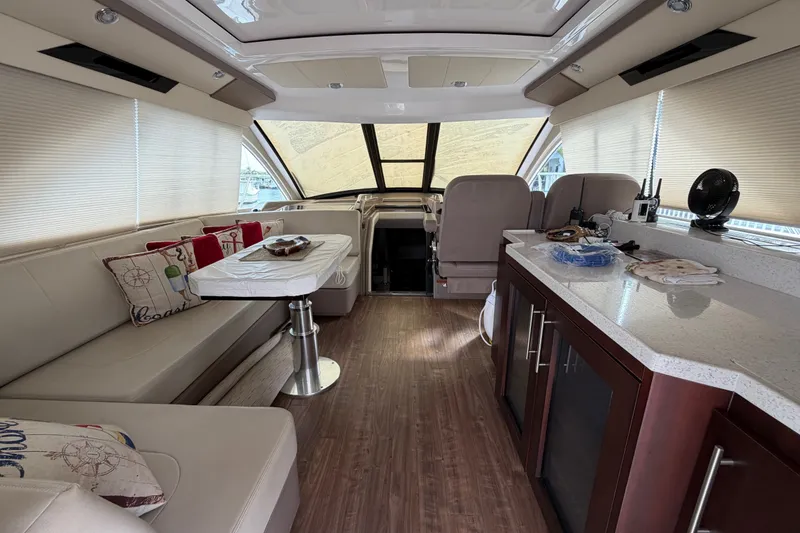 Slide: The Image of Luxurious interior of a 2018 Regal 53 Sport Coupe yacht with modern furnishings. - 69