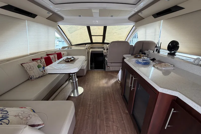 Slide: The Image of Luxurious interior of a 2018 Regal 53 Sport Coupe yacht with modern furnishings. - 67