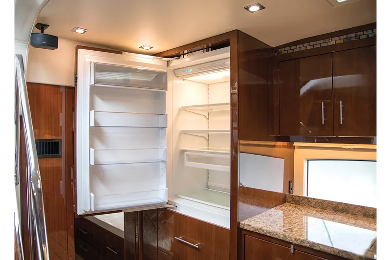 Slide: The Image of Manufacturer Provided Image: Luxurious kitchen interior of 2018 Regal 53 Sport Coupe with open refrigerator. - 130