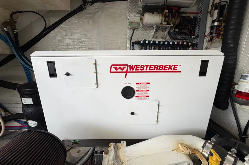 Slide: The Image of Westerbeke generator in 2018 Regal 53 Sport Coupe engine room. - 61