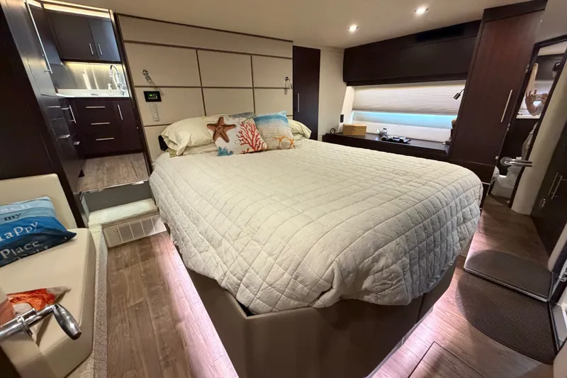 Slide: The Image of Luxurious 2018 Regal 53 Sport Coupe bedroom with modern decor and ambient lighting. - 104