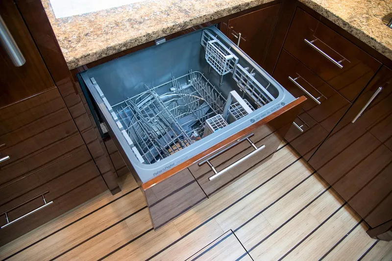 Slide: The Image of Manufacturer Provided Image: Built-in dishwasher in 2018 Regal 53 Sport Coupe yacht kitchen. - 131