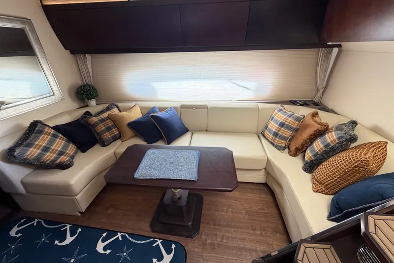 Slide: The Image of Luxurious interior of 2018 Regal 53 Sport Coupe with plush seating and decorative pillows. - 93