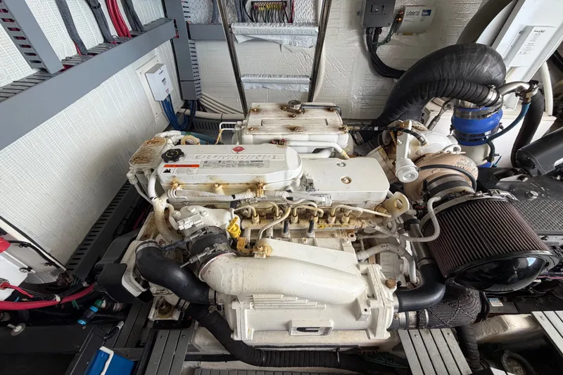 Slide: The Image of Engine compartment of a 2018 Regal 53 Sport Coupe, featuring a Cummins marine engine. - 51