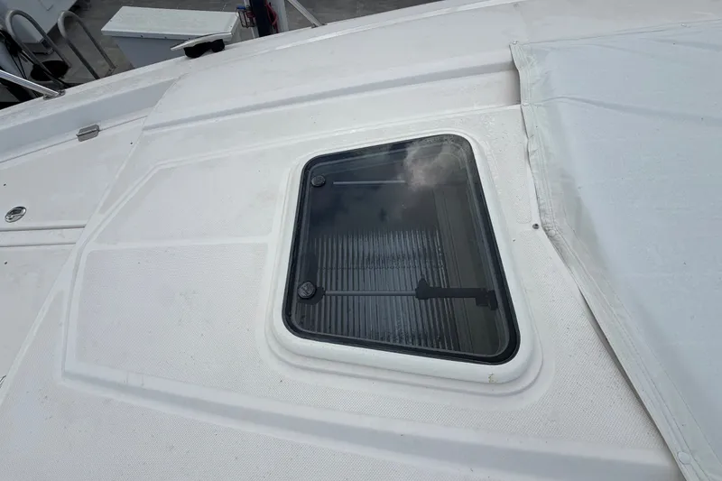 Slide: The Image of 2018 Regal 53 Sport Coupe yacht deck with a closed hatch window. - 43