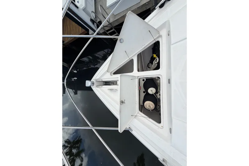 Slide: The Image of 2018 Regal 53 Sport Coupe yacht deck with open storage compartments. - 44