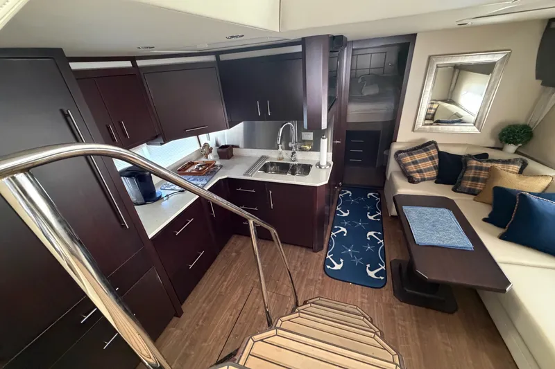 Slide: The Image of Luxurious interior of 2018 Regal 53 Sport Coupe yacht with modern kitchen and cozy seating area. - 91
