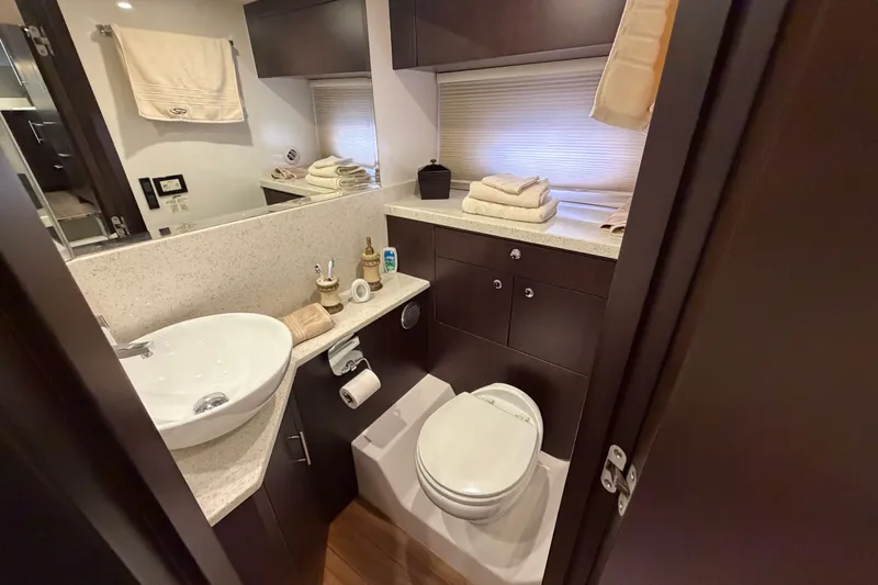 Slide: The Image of Luxurious bathroom in 2018 Regal 53 Sport Coupe yacht, featuring modern fixtures and elegant design. - 102