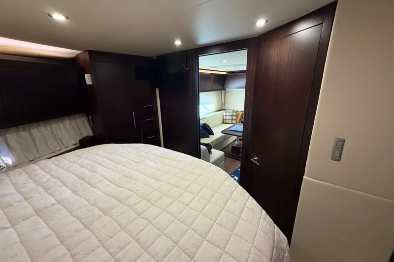 Slide: The Image of Luxurious interior of 2018 Regal 53 Sport Coupe yacht with cozy bedroom and elegant furnishings. - 121
