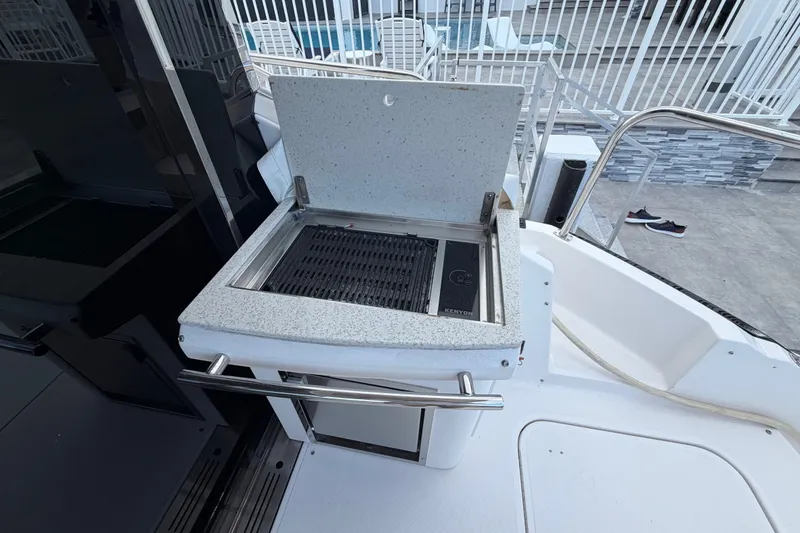 Slide: The Image of Outdoor grill on a 2018 Regal 53 Sport Coupe yacht deck. - 32