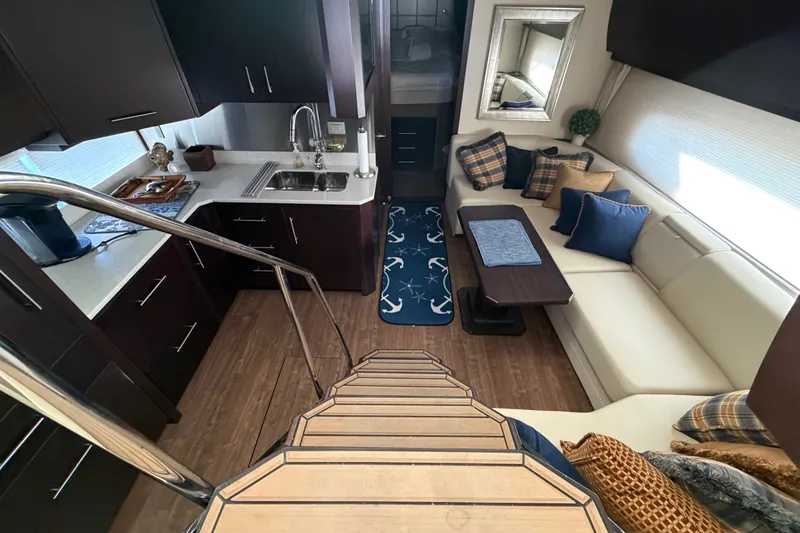 Slide: The Image of Luxurious interior of 2018 Regal 53 Sport Coupe yacht with modern kitchen and cozy seating area. - 89
