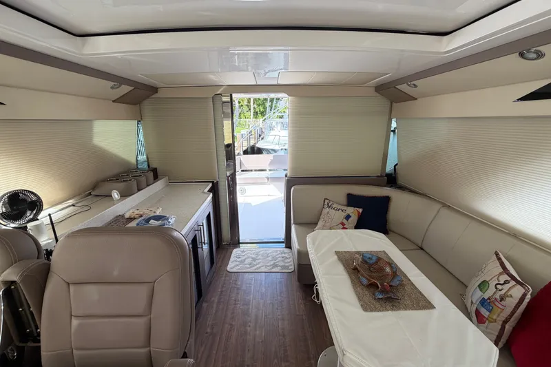 Slide: The Image of Luxurious interior of a 2018 Regal 53 Sport Coupe yacht with elegant seating and decor. - 85