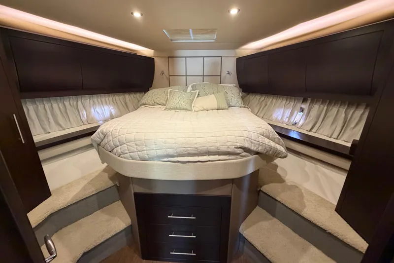 Slide: The Image of Luxurious bedroom interior of 2018 Regal 53 Sport Coupe yacht with elegant bedding. - 117
