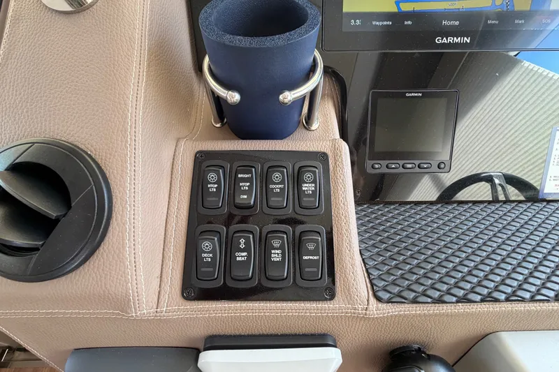 Slide: The Image of Control panel of a 2018 Regal 53 Sport Coupe with Garmin navigation system. - 73