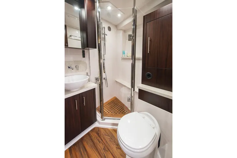 Slide: The Image of Manufacturer Provided Image: 2018 Regal 53 Sport Coupe bathroom with modern fixtures and wooden accents. - 132