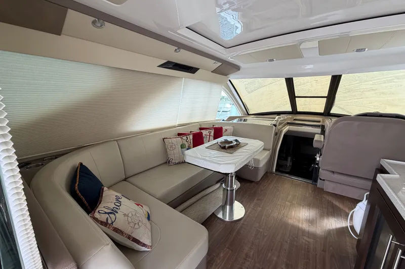 Slide: The Image of Luxurious interior of a 2018 Regal 53 Sport Coupe yacht with elegant seating and decor. - 70