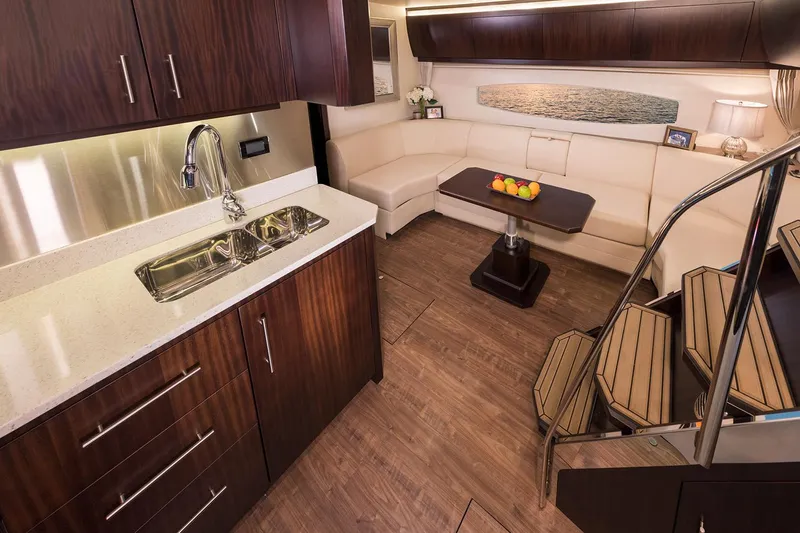 Slide: The Image of Manufacturer Provided Image: Luxurious interior of 2018 Regal 53 Sport Coupe with modern kitchen and cozy seating area. - 127