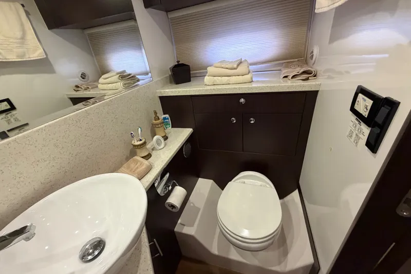Slide: The Image of Luxurious bathroom in 2018 Regal 53 Sport Coupe yacht with modern fixtures and elegant design. - 103