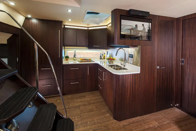 Slide: The Image of Manufacturer Provided Image: Luxurious kitchen interior of 2018 Regal 53 Sport Coupe yacht with modern amenities. - 128