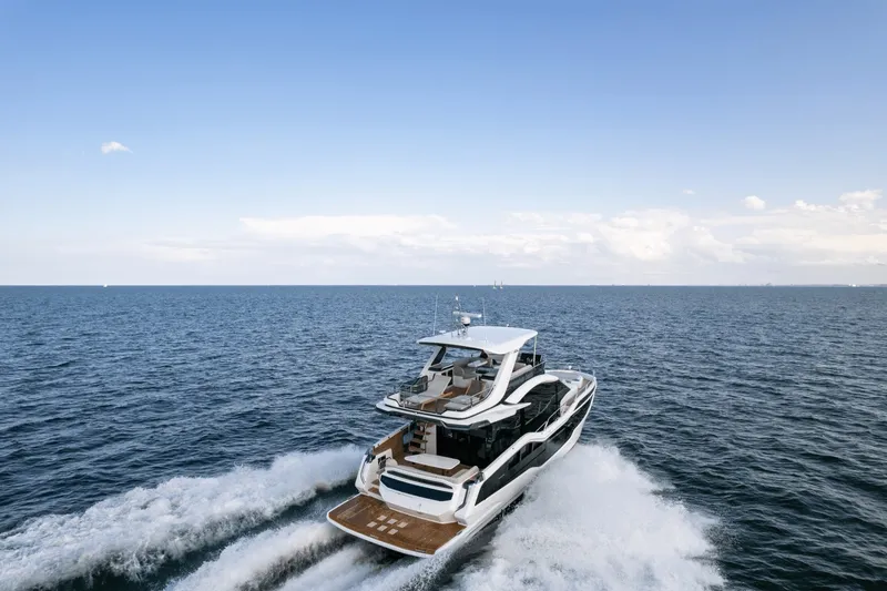 Slide: The Image of 2026 Galeon 560 Fly cruising on open water, featuring sleek design and spacious deck. - 11