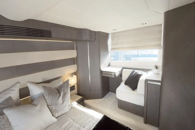 Slide: The Image of Luxurious cabin of the 2026 Galeon 560 Fly with elegant furnishings and large windows. - 44