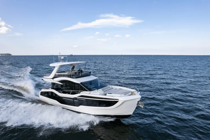 Slide: The Image of The 2026 Galeon 560 Fly cruising swiftly across the open sea. - 0