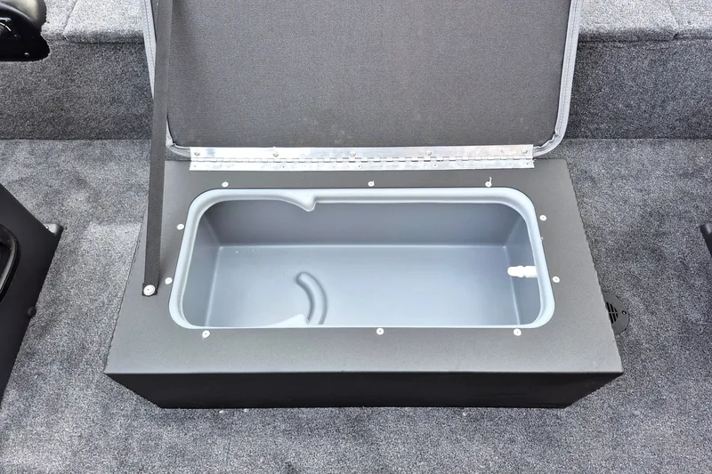 Slide: The Image of Open storage compartment in 2027 Tracker Panfish 17 boat, featuring a spacious interior. - 13