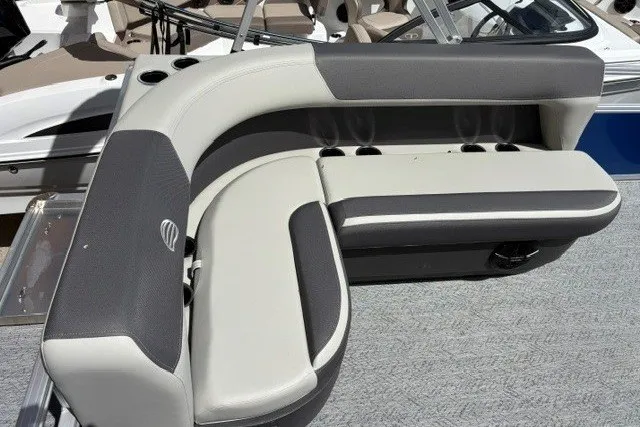 Slide: The Image of 2027 Sun Tracker Bass Buggy 16 XL Select boat seating, featuring gray and white cushioned design. - 14