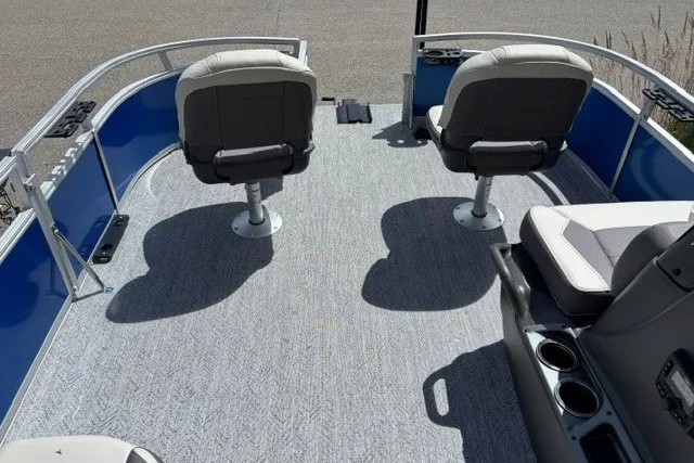 Slide: The Image of 2027 Sun Tracker Bass Buggy 16 XL Select pontoon boat interior with seating and cup holders. - 13