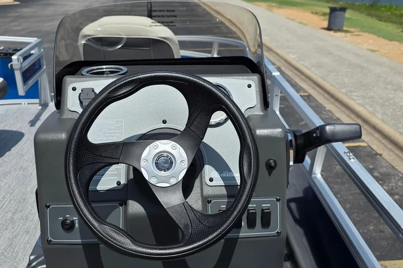 Slide: The Image of Steering console of 2027 Sun Tracker Bass Buggy 16 XL Select pontoon boat. - 13