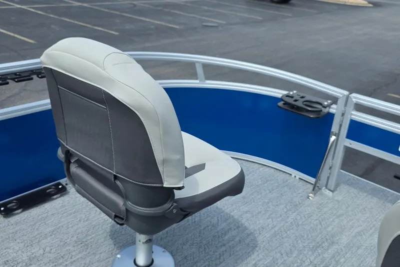 Slide: The Image of Sun Tracker Bass Buggy 16 XL Select 2027 boat seat, gray upholstery, blue panel background. - 16