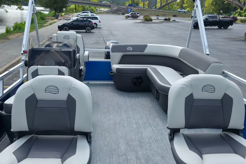 Slide: The Image of 2027 Sun Tracker Bass Buggy 16 XL Select pontoon boat interior with gray seating. - 20