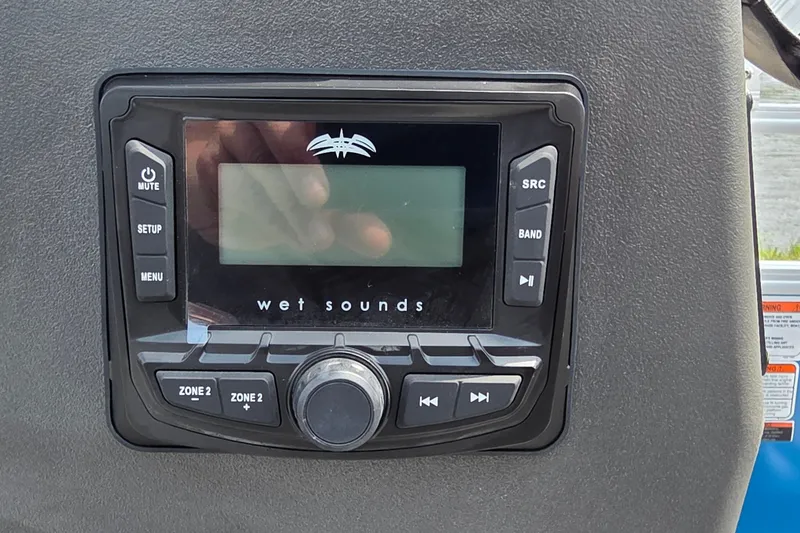 Slide: The Image of Wet Sounds audio system on 2027 Sun Tracker Bass Buggy 16 XL Select boat dashboard. - 17