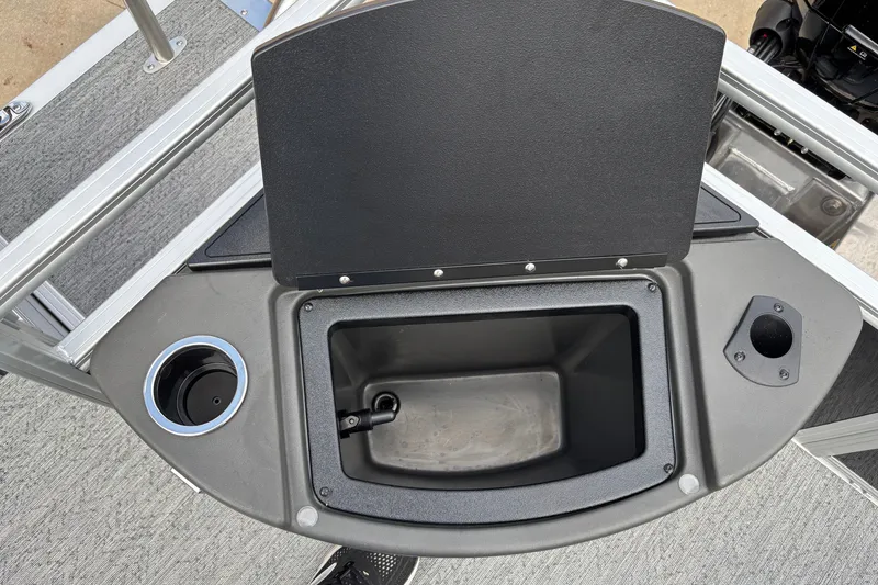 Slide: The Image of Open storage compartment on 2027 Sun Tracker Bass Buggy 18 DLX boat deck. - 13
