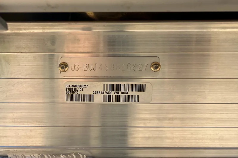 Slide: The Image of 2027 Sun Tracker Bass Buggy 18 DLX identification plate with serial numbers and barcodes. - 15