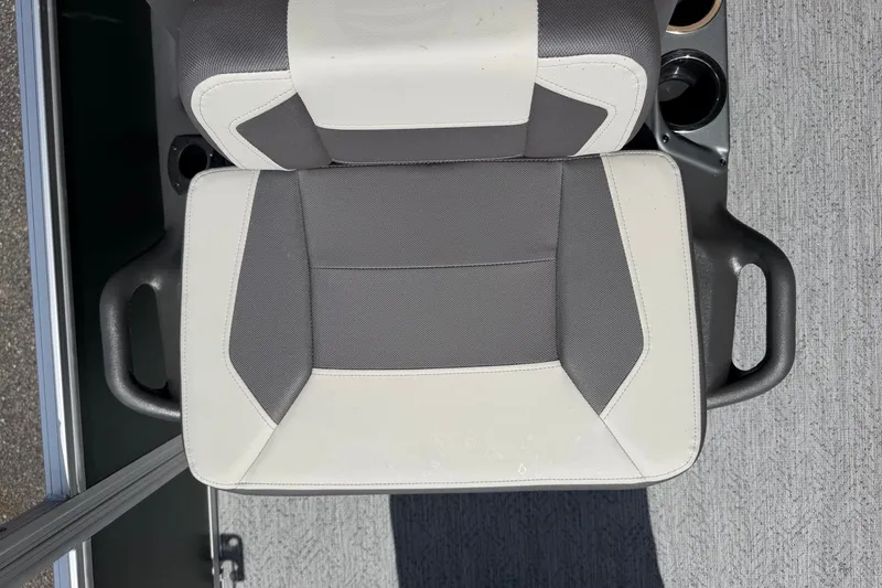 Slide: The Image of 2027 Sun Tracker Bass Buggy 18 DLX boat seat, gray and white upholstery, top view. - 18