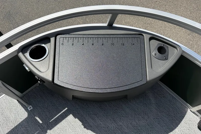 Slide: The Image of 2027 Sun Tracker Bass Buggy 18 DLX fishing station with ruler and cup holders. - 16
