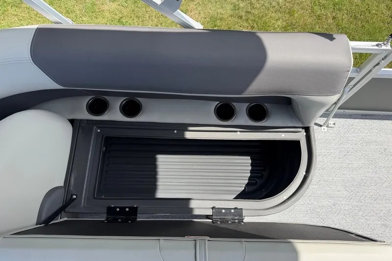 Slide: The Image of Interior view of 2027 Sun Tracker Bass Buggy 18 DLX boat with storage compartment. - 21