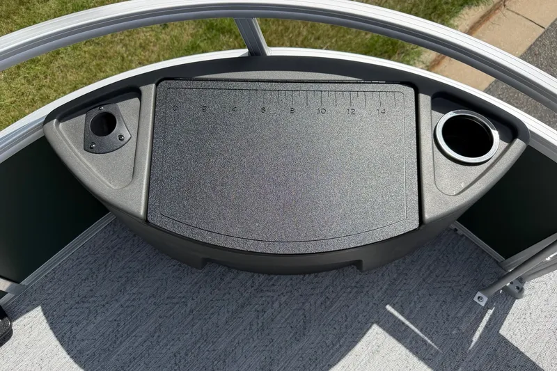 Slide: The Image of Sun Tracker Bass Buggy 18 DLX 2027 boat deck with cup holders and measuring board. - 14