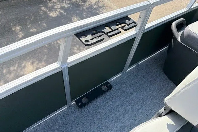 Slide: The Image of 2027 Sun Tracker Bass Buggy 16 XL Select pontoon boat interior with cup holders and seating. - 15