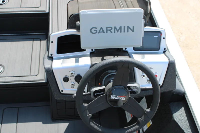 Slide: The Image of Steering console of 2027 Tracker Savage 215 with Garmin navigation system. - 13