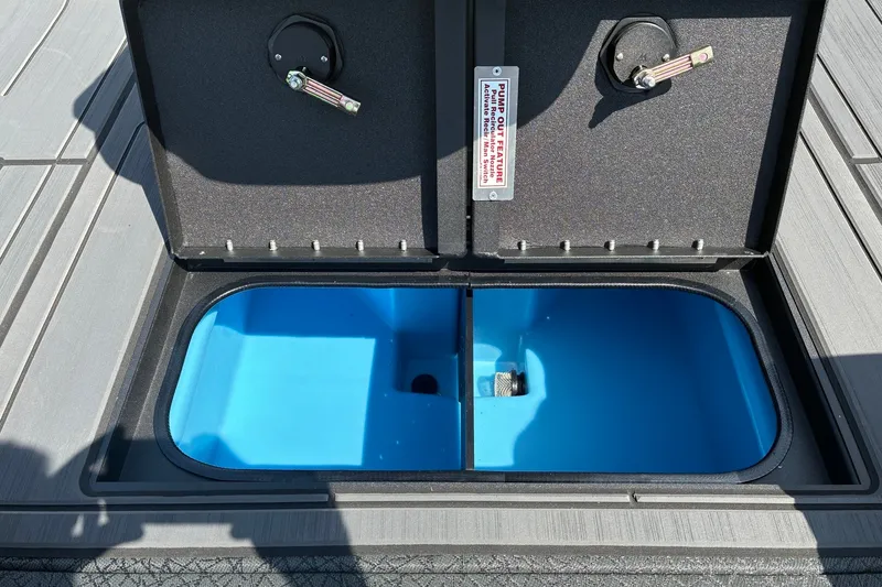 Slide: The Image of Open storage compartment on 2027 Tracker Savage 215 boat deck. - 15