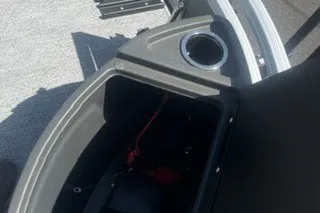 Slide: The Image of Storage compartment of 2027 Sun Tracker Bass Buggy 18 DLX with cup holder. - 17