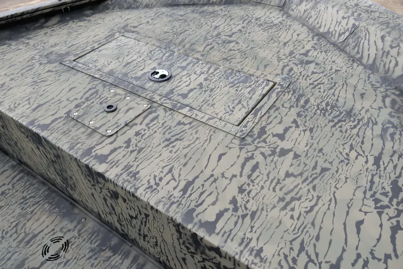 Slide: The Image of 2026 Tracker Grizzly 1648 SC boat with camouflage pattern deck. - 13